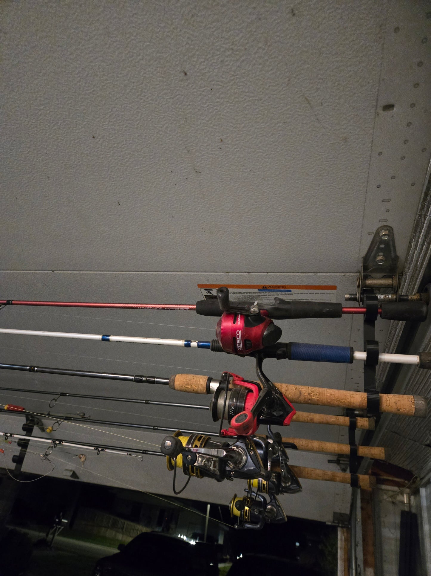 Garage door snap on fishing pole organizer - 4 pole variation